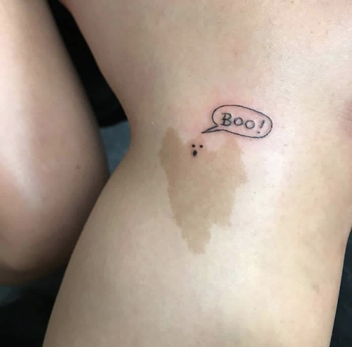 Here is another clever tattoo idea, this time in conjunction with a birthmark. As a matter of fact, this birthmark does look kind of like a ghost, which makes it even more hilarious to tattoo eyes, a mouth, and the word Boo above it that much more hilarious.